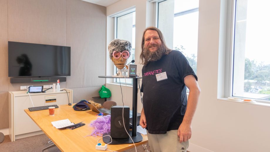 Person standing next to a machine