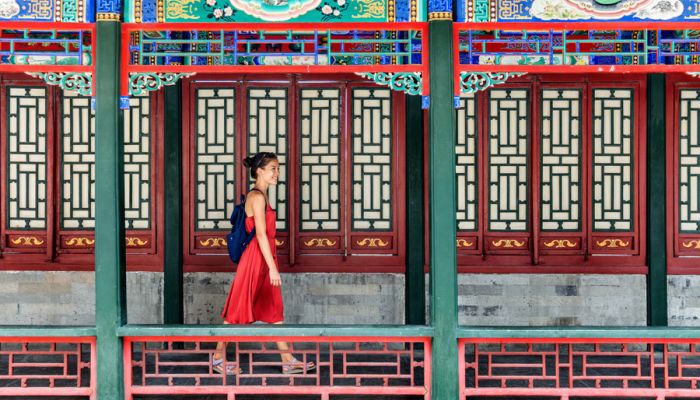 A women walking through Chinese palace